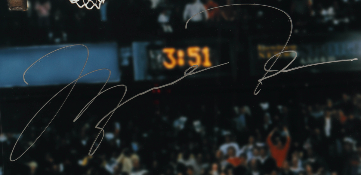 Close-up of the large silver-colored Michael Jordan signature on the photograph