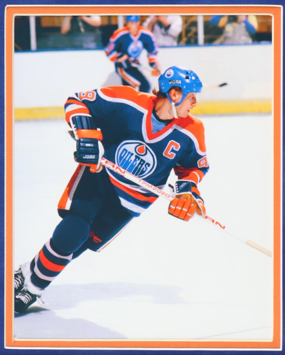 Detail of the left Wayne Gretzky action photograph in the framed display